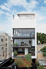 Tall and surprisingly open, the Tel Aviv Town House by Pitsou Kedem Architects continues in the tradition of its Bauhaus-inspired neighbors with a white facade and black window frames. Six stories high, crowned with a pool, and with a direct lineage back to the Bauhaus, the house manages to both embrace and provide refuge from the teeming Israeli city.