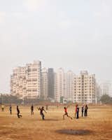 An impromptu cricket game occupies locals in Navi Mumbai.