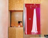 The Trzebiatowskis’ bathroom retains the spirit of Arizona heat with its shocking magenta ceilings, floors, and walls. The vanity is anything but—opting for art instead of a mounted mirror—and is made from sanded and sealed oriented strand board (OSB), a waste material typically used in framing.