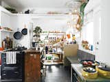 Designer Omer Arbel develops his latest works inside an eclectic Vancouver home filled with a teeming assortment of pets and prototypes. Hanging over the bench is our first Bocci 14 light fixture. I feel like it would be bad luck not to have it in the house. Other pieces in the kitchen—like the wooden island Aileen found in an alleyway and the yellow ceramics by Knabstrup, a Danish company active in the 1960s—we’ve collected along the way.” Photo by José Mandojana.