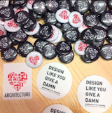 @colorhousepaint: Stickers and buttons with a heart. Our fave swag at Dwell on Design NY from @archforhumanity #DODNY