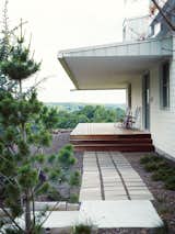 Outdoor, Pavers, Wood, Walkways, Trees, and Hardscapes MODERN TAKE ON A TRADITIONAL FARMHOUSE IN MISSOURI

Thanks to Matthew Hufft, their envelope-pushing architect and longtime friend, Hannah and Paul Catlett have a new home in southwestern Missouri that’s a fresh, unconventional take on the traditional farmhouse. The homeowners call the house Porch House after it's majestic wraparound porch.

photos by: Joe Pugliese  Outdoor Walkways Trees Wood Pavers Photos from Ozark Original