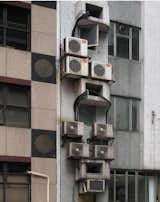 An exterior detail shows a jumble of air-conditioning units. Photo by Michael Wolf, courtesy of the Flowers Gallery.  Photo 3 of 7 in Megacity Living in Hong Kong: Architecture of Density