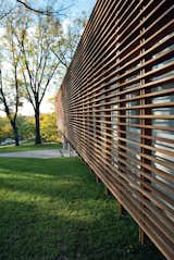 Contemporary Kansas Home with Wood Slatted Exterior Screen