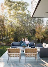 Outdoor, Back Yard, Side Yard, Front Yard, and Wood Patio, Porch, Deck The chairs on the terrace are from the Rusa collection by KAA Design, and the Diamond outdoor sofas are from Cane-line.  Photos from Modern Lakeside Retreat Stripped Down to the Basics