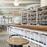 For The Standard Grill in New York City, Roman and Williams designed stools that feature metal legs and wood seats.  Photo 5 of 11 in Bar by Amy Gaddis from How to Find the Perfect Modern Bar Stool