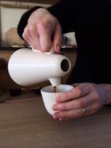 Demonstrating how to pour with a Sucabaruca prototype at Mjölk.  Photo 4 of 6 in Product of the Day: Ceramic and Wood Coffee Set by Luca Nichetto