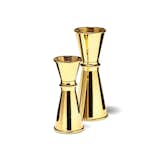 Available in both 1 oz. and 2 oz. sizes, the gold-plated jiggers are an elegant addition to a barware collection. The 1 oz. jigger includes vessels for both ½ ounce and 1 ounce of liquid, and the 2 oz. jigger includes vessels for both 1 ounce and 2 ounces of liquid. Both jiggers have a simple silhouette that resembles a classic hourglass.