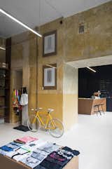 The ochre concrete walls have a deliberately rough quality to them. Photo by Anna Domańska.  Photo 3 of 7 in A Design Boutique Opens in Poland