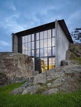 The Pierre by Olson Kundig Architects: An elegant, brutalist building is integrated into the surrounding rocky landscape. Photo by Benjamin Benschneider.
