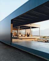 The Desert House located in Desert Hot Springs is a steel structure designed with large expansive windows, and concrete flooring.