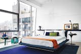 In the master bedroom, a sculpture by Maya Lin hangs above a Siena bed from B&B Italia.  Photo 3 of 5 in Bold Glass Bedrooms by Allie Weiss from Eye in the Sky: Urban Apartment Overlooking NYC's The High Line