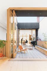 A third-floor courtyard stands in for a backyard and gives Elodie, the couple’s two-year-old daughter, a place to play outdoors. A Hunting chair by Børge Mogensen shares the space with a child’s chair by 

Tomii Takashi and a vintage Danish coffee table.