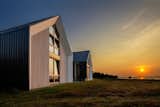 In the Acadian village of Caraquet, YH2 Architecture raised two identical cabins on a site 200 feet from the sandy shores of Chaleur Bay. The home is inhabited by a single family and used as a vacation spot.  Search “eco friendly penthouse canada” from A View So Strong, It Had to Be Shared