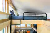 With two sleeping lofts and a convertible daybed, the Traveler can accommodate six.  Photo 3 of 7 in Loft by Esmeralda from This Travel-Ready Trailer May Look Small, But It Can Sleep Six