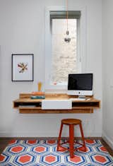 Office, Study Room Type, Desk, Rug Floor, and Dark Hardwood Floor Working is much more pleasant when you have natural light to brighten up your space. If you aren’t lucky enough to have a window, then invest in some stylish lighting.  Photo 6 of 6 in 6 Ways to Turn Your Home Office Into a Distraction-Free Zone from Lakeview