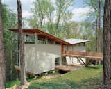 Designed by Frank Harmon this residence features deep roof overhangs shade the interior from high summer sun.