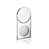 She came across drawings by Jean Puiforcat, who was active during the Art Deco period, and was attracted to the geometric nature of his work. She saw circles, squares, and rectangles and continued in this vein. A cigar cutter is shown here.