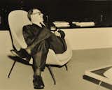 Eero Saarinen sitting in a Womb chair. Photo courtesy of Harvey Croze, Cranbrook.