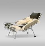 The lush design for the Flag Halyard Chair (1950) was supposedly inspired by a day at the beach, when Wegner was slowing carving himself a spot in the sand to relax. Lounging is supported by 240 meters of flag line strung through a steel frame and sheepskin covering—those coveting this chair can even reserve their own sheepskin. Manufactured by PP Møbler.