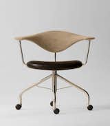 During a Danish furniture trade show, Dr. Eigill Snorrason critiqued the industry for not paying enough attention to ergonomics. The Swivel Chair (1955) Wegner’s rejoinder of sorts, an elegant backrest of hand-carved wood that’s been compared to a gently bent propeller. The smooth lines, thin profile and wheels invite a sure-footed slide across any office. Manufactured by PP Møbler.