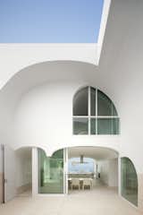 Dramatic arches characterize this enigmatic California beach house that's elevated six feet above the sand to guard from major storms. Called the Vault House, it was designed by architecture firm Johnston Marklee. As principal Mark Lee explains: “The envelope was so strict that the design process was more subtractive than additive; we carved away a solid mass to create the rooms. We were reluctant to broadcast the content right away, preferring to mask the complexity and reveal it a little at a time.”