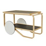 Designed by Alvar Aalto in 1936, the Artek 901 Tea Trolley is a surprisingly updated take on traditional bar carts and tea trays. The sculpted, natural lacquered birch frame is paired with two shelves and white lacquered MDF wheels with black rubber rings to provide smooth movement without damaging floors. The trolley is defined by its play of sharp and soft corners, rectangular and round shapes.

The Artek Tea Trolley is currently on sale for 15% off at the Dwell Store until 10/25/2015.