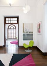 Dis. focused on the use of furniture and lighting to emphasize and promote Norwegian design, preserving the building’s original character. The residence’s large rooms feature dark wood floors, which sets off bright playful elements such as sculptural Fly Me chairs from Martela and vividly colored Rombo carpets by Kinnasand.  Photo 1 of 7 in Designing Norwegian in Sri Lanka by Ali B. Zagat