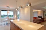 The 1Light pendants above the kitchen island are from Eurofase.