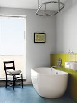 Bath Room, Freestanding Tub, and Soaking Tub A Lisbon freestanding tub and “a church chair from a junk shop” complete the children’s bathroom.  Photo 6 of 6 in Ways to Use Color at Home by Diana Budds from Centuries-Old Farmhouses Inspired This Timeless Home
