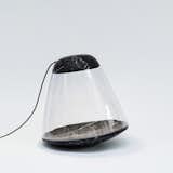 Apollo Lamp

The lunar-esque floor lamp features an LED bulb that highlights the material interplay between dark marble and light glass.