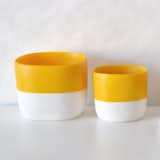 San Francisco designer Tina Frey creates modern resin products for the home, using a thoroughly executed design, hand sculpting, and hand casting process. The Striped Square Vessel is a versatile piece that can be used as a bowl, planter, or as storage for small items. The vessel is cast in a two-tone—providing a bright pop of color in its yolk-yellow top half, and a stark white base that is a nice counter to the saturated upper half.