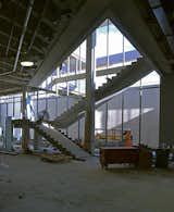 This image of the Visitor Center in construction shows light perforating down from the Visitor Center's upper story into the galleries through an open stairwell.