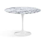 Part of the Pedestal collection introduced by Eero Saarinen as an answer to "the ugly, confusing, unrestful world" that lay beneath the surfaces of chairs and tables, this 42" round dining table comes in both Arabescato marble (shiny or matte finish), and a white laminate.