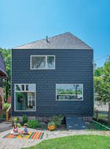 A couple in Evanston, Illinois, asked John Issa of Perimeter Architects to add on a two-story, 650-square-foot addition to their traditional farmhouse. The new volume is clad in composite slate siding by Inspire Roofing Products; the windows are Pella.