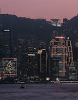 The Hong Kong skyline, including the HSBC building designed by Foster + Partners (foreground) and the Peak Tower designed by Terry Farrell (illuminated at top). Image courtesy of the Royal Institute of British Architects.