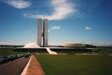 One of Niemeyer’s numerous contributions to Brasilia, the custom-built capital created out of thin air in the ‘60s, the National Congress building symbolizes the working of the legislative branch; two semicircles, one for the Congress and one for the Senate, are divided by twin office towers.  Search “michael-gainer-nice-modernist.html” from Design Icon: Oscar Niemeyer