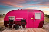An innovative splash of color carries this trailer into compatibility with the pink clouds striating the horizon.