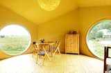 The interior of Jaanus Orgusaar's NOA cabin in the Virumaa region of Estonia. The wide windows provide a great view of the surroundings.