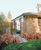 Cox says he and Persin “went on an ipe run” after committing to the material for the deck, using it to build the slatted fence around the backyard. Rainbow Warrior New Zealand flax, a perennial, complements the material, while off-the-shelf pavers helped keep costs down.