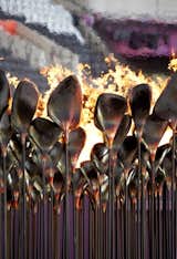 Olympic CauldronA billion people tuning into the Olympics’ opening ceremony meant all eyes on the torch—or at least on the person carrying it. Heatherwick says nobody remembers the Olympic Cauldron. "People remember people, not objects." So the London Olympics featured seven young athletes carrying copper cones of fire—"Gold, silver, and bronze were busy for those two weeks"—and touched the cauldron with their torches until the flames spread around in circles. Some 204 stems, each representing a country, rose together to form a single massive flame—truly more than the sum of its parts.Photo by: Edmund Sumner