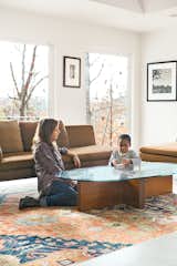 Birdsall plays with her son Atticus in the living room next to a Charles sofa from B&B Italia. Formwork also designed the coffee table—fitting, since the architects come from strong fabrication backgrounds.