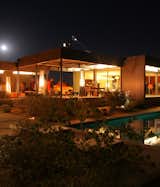 Despite prefab's ability to cut down on site construction time, delivery of components is still reliant mainly on trucks—it's a pure intersection of design and mobility. It took eight flatbeds to deliver the Marmol Radziner–designed prefab house in Desert Hot Springs, now owned by Kristopher Dukes and Matt Jacobsen, who hosted a private dinner for Dwell and Volvo during Modernism Week. The topics of conversation? Mobility and design, technology, and the future.