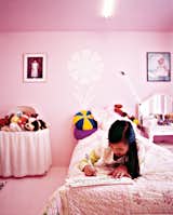 Inside the Wibowo house in Puyallup, Washington, the space is spare but infused with color because "painting is the cheapest way to decorate." Twelve-year-old Tabitha's room is pink. Photo by John Clarke.
