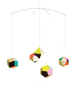 Spot color printed balls of woodfree paper dangle kaleidoscopically above children with the Themis Mobile. The mobile's geometric patterns designed by Clara von Zweigbergk modernize this classic.  Search “themis mobile mono” from Modern Low-Tech Toys