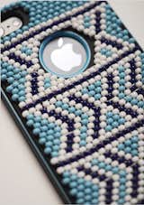 Beaded iPhone Cover by Vukile BatyiIt takes Durban-based designer Vukile Batyi two days to hand stitch all the beads on one of his unique Afro-bling cell phone covers. "I want to push them to the next level,” he says. “I don't want any to look similar.” Batyi collaborates with his mentor and friend Laduma Ngxokolo, whose Xhosa-inspired knitware has similar motifs. The Emerging Creatives program, in which Batyi participated, had a breakout year, collectively showing much stronger and more developed work than before.