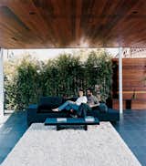 Outdoor and Back Yard Sebastian and Maricarmen take in the scenery from the comfort of their exposed living room. The couple sits on a Polder sofa by Hella Jongerius for Vitra.  Photo 6 of 7 in Sebastian Mariscal's Wood Architecture from Double the Pleasure