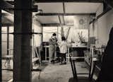 George Nakashima with his daughter Mira in his workshop.