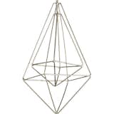 The Wire Drop Silver Ornament by CB2 shows that negative space, when carved out by a wire frame, can be a beautiful thing.