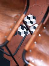 Aumas added a few new cement tiles to shore up the kitchen floor.  Photo 6 of 6 in Five Hexagonal Furniture and Accessory Pieces by Diana Budds from A Furniture Collector's Renovated Flat in Paris